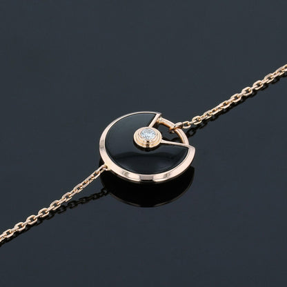 Cartier Amulette XS onyx, diamond and gold bracelet