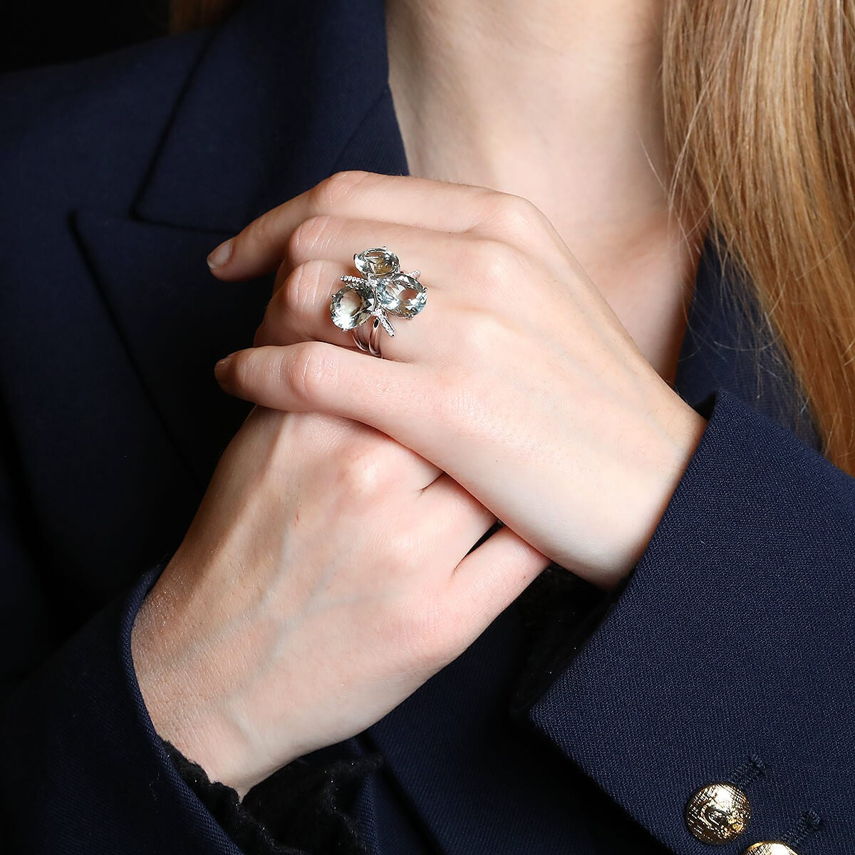 Diamonds, green natural stones and gold ring