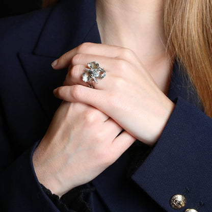 Diamonds, green natural stones and gold ring