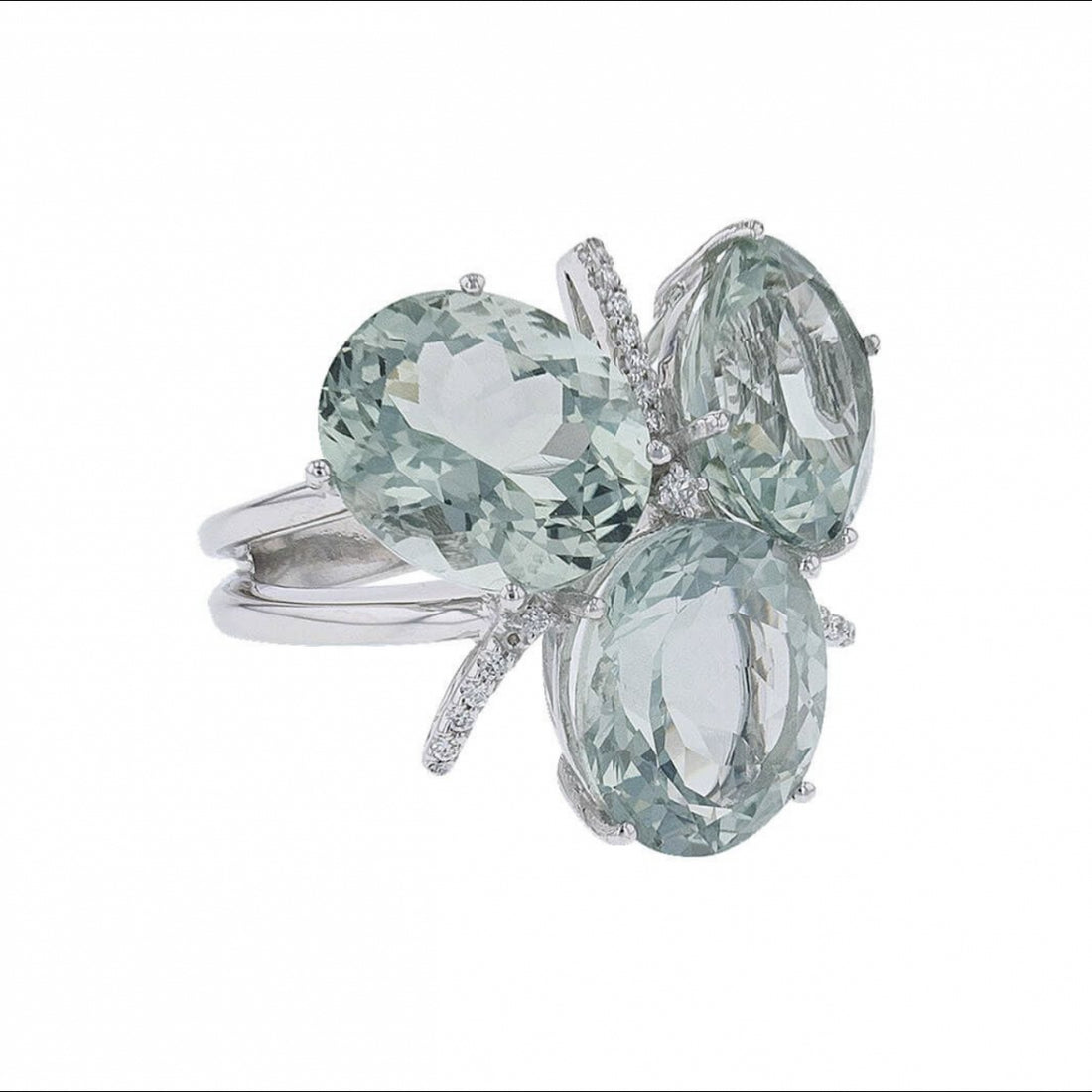 Diamonds, green natural stones and gold ring