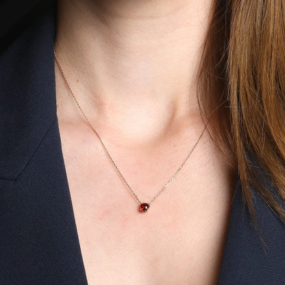Fred garnet and gold necklace